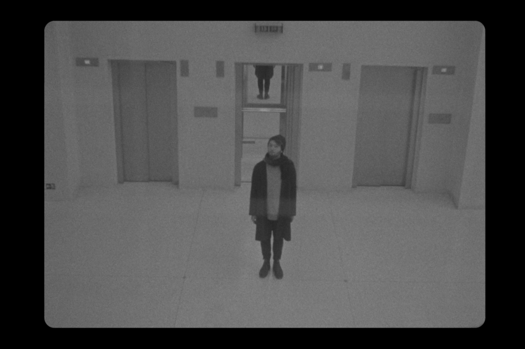 Elevator in empty space with guy in centre